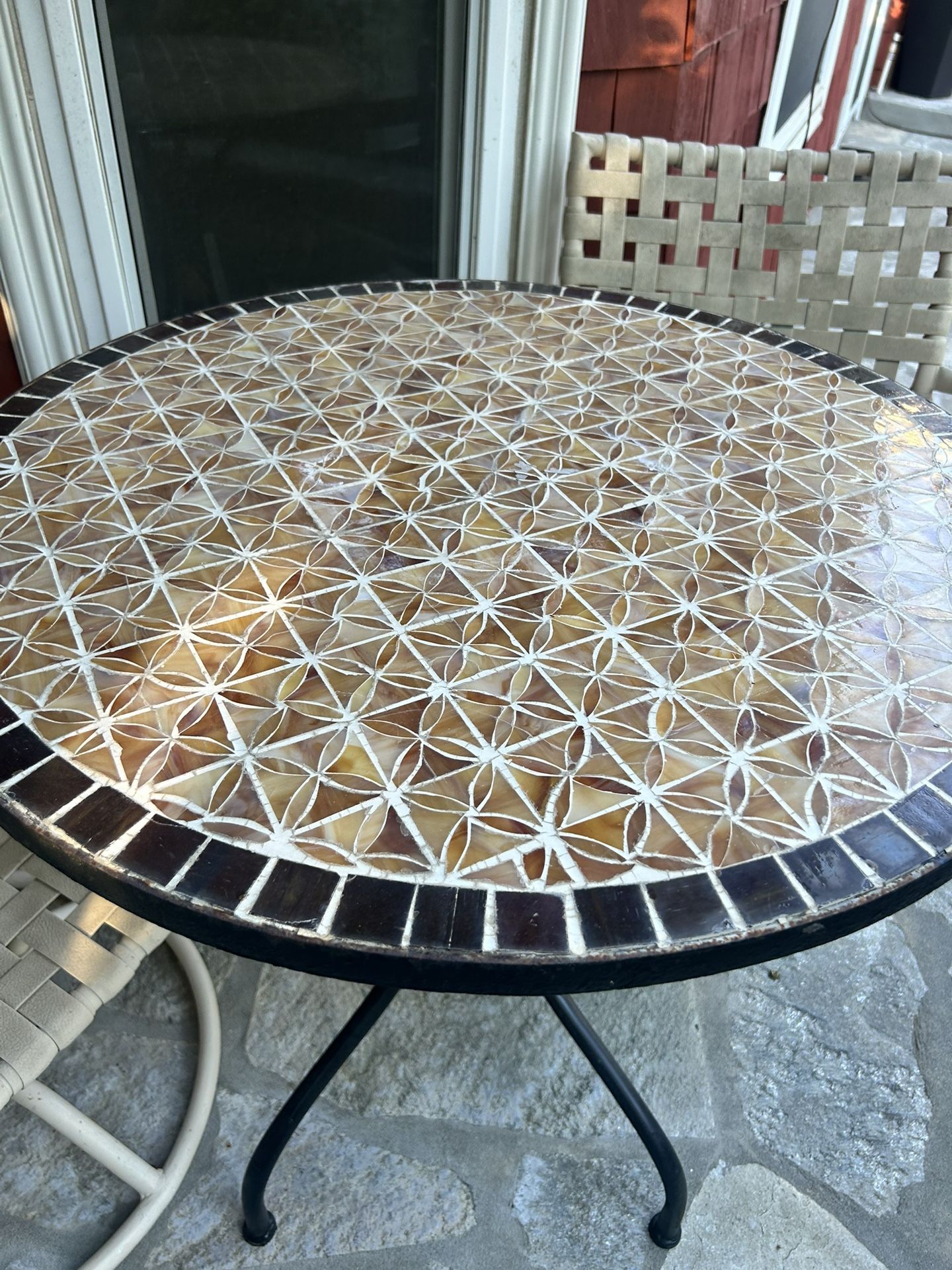 3 Piece Outdoor Bistro Set with Tiled Table Table is hand made tile and heavy. Chairs are swiveling