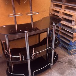 Small bar table, and two faux leather swivel bar chairs