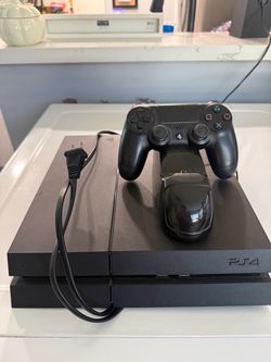 PS4 with controller and charging station