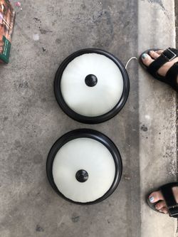 Two light fixtures close to ceiling