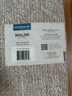 Malini  off white area rug