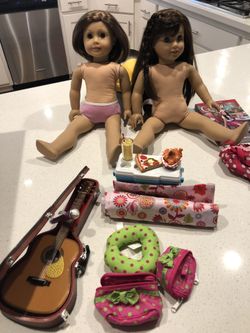 American girl dolls, guitar,and a few camping items