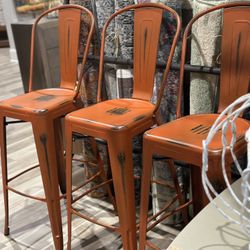 THREE 30” orange Richart BAR height Stools. MSRP $744. Our price $225 + sales tax  