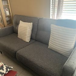 7 Feet Sofa, With Two Cushions. Grey In Color 