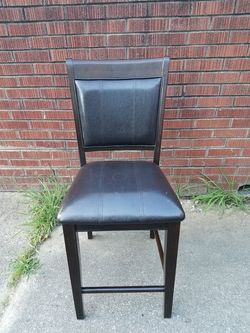 Bar stool; high chair; dark brown; only one; still good.  Missing right bottom brace; leatherette; see pics - $10
