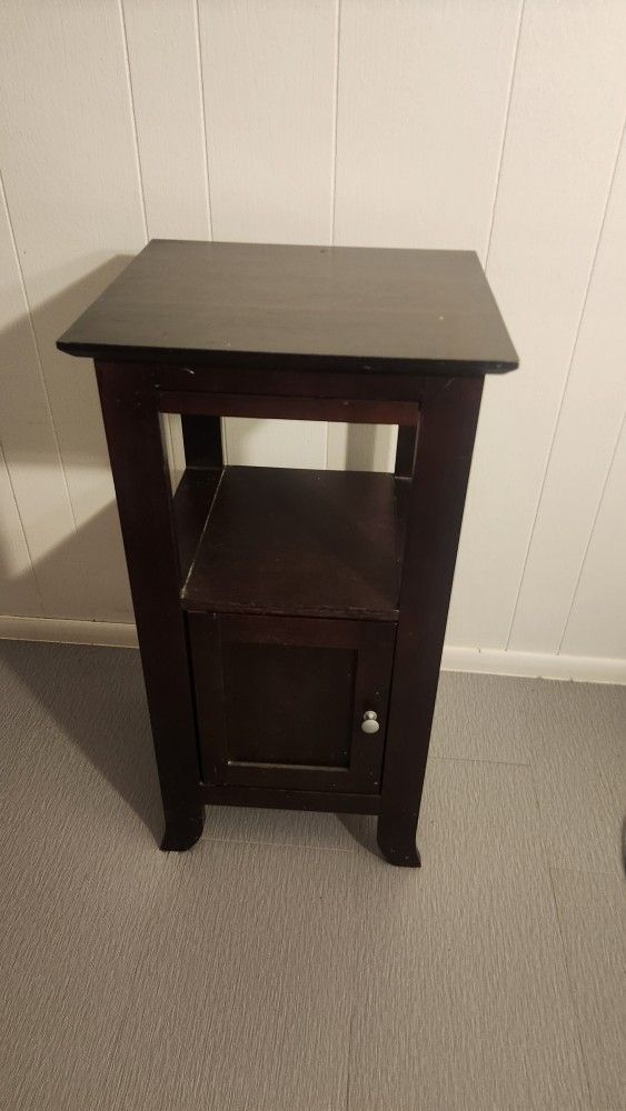 Cherrywood curio table.