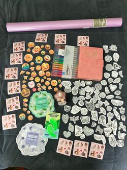 Bundle of gel pens, journal, coloring stickers, emoji stickers, beauty masques, body shimmer oil, gift wrap