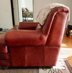 Red leather chair and ottoman