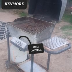 KENMORE TWIN CONTROL PROANE BBQ GRILL WITH KART. DON'T LET THE PRICE FOOL YOU. THIS IS A GOOD BBQ