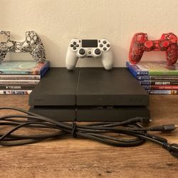 Ps4 Fat With 10 Game Discs, 2 Controller Skins, Controller, Console, HDMI Cord , Power Cord.