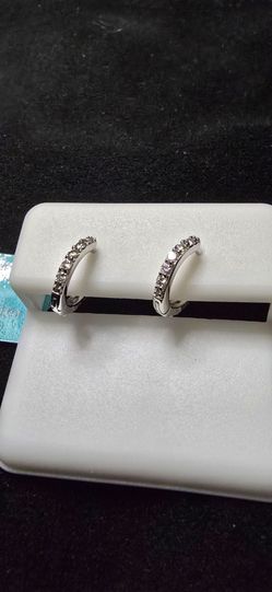 Mini moissanite huggies set in sterling silver. 925