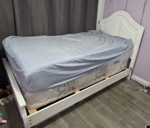Twin bed with mattress and box spring
