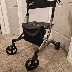 Nice Carex Crosstour Rolling Walker with locking brakes & storage bag. Soft contouring back rest.
