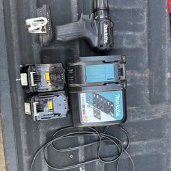 Makita drill, battery charger, and two batteries