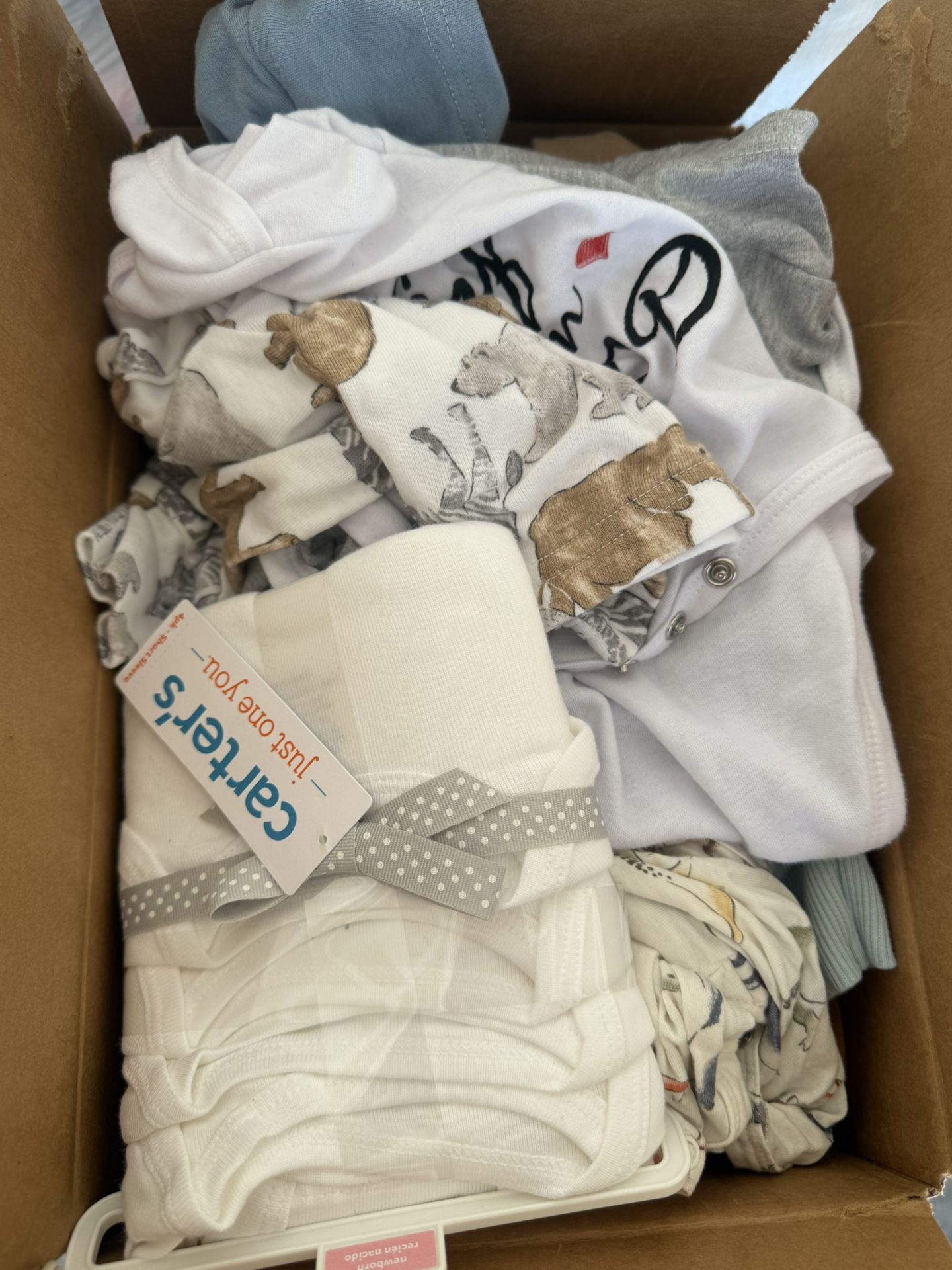 3 Boxes Of Baby Clothes