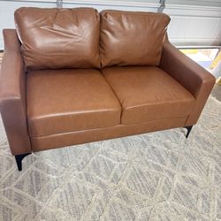 Read Description Serta Francis 55.5 in. Brown Faux Leather 2-Seater Loveseat