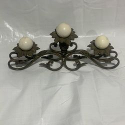 Metal candle holder with candles