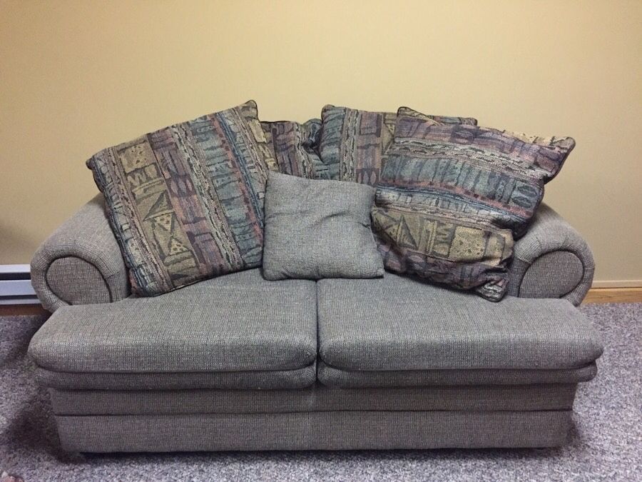 Loveseat sofa with pillows