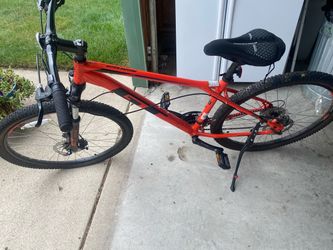 Orange mountain bike with front suspension