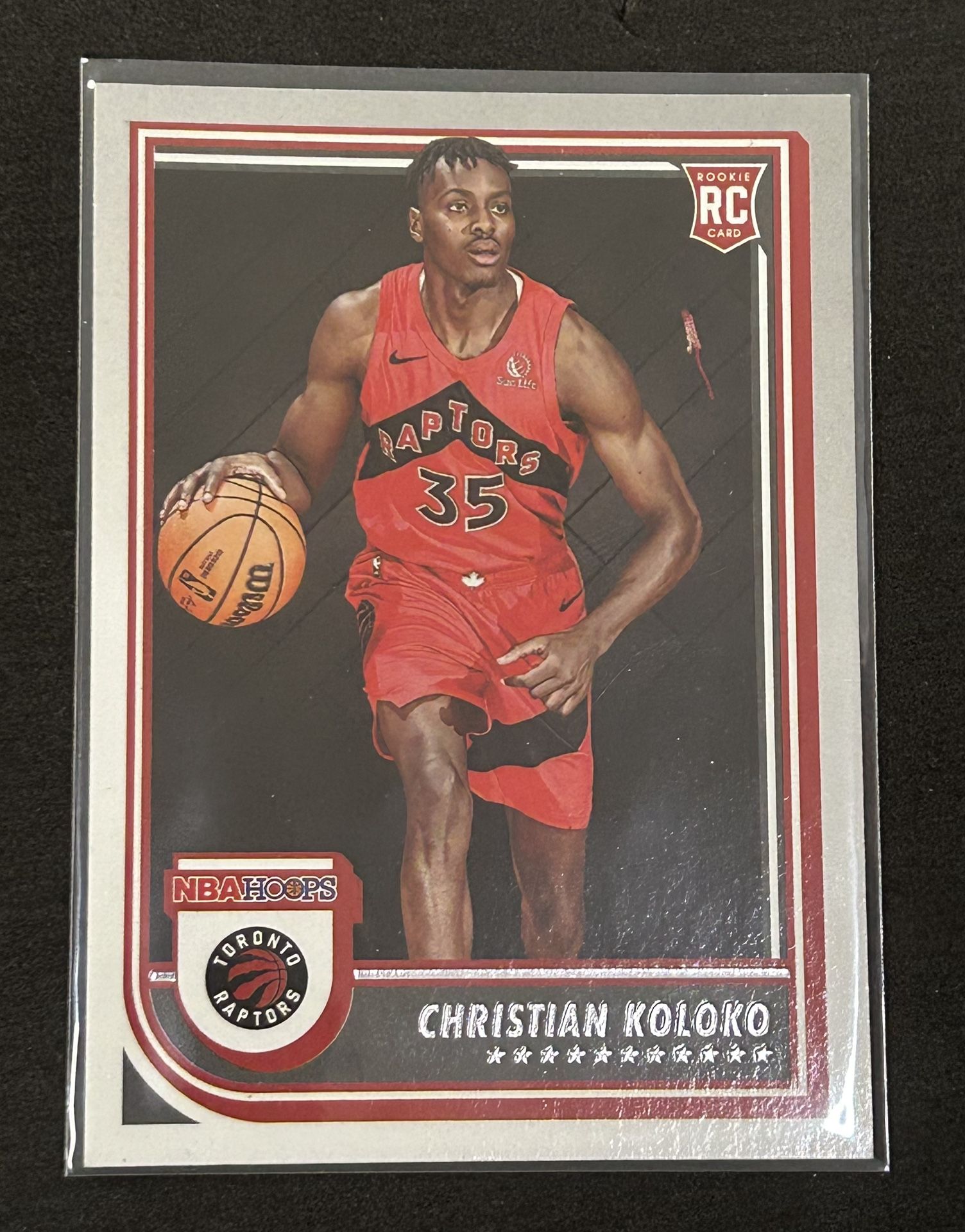 2022-23 Panini NBA Hoops Card #261 Christian Koloko Toronto Raptors (RC)
