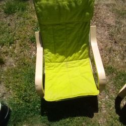 Two Children Size Rocking Chairs With Green Removable Chair Covers That Can Be Washed. 