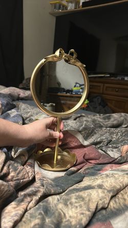 Gold Vanity Mirror with Bow Detail and White Cross that says  Love.