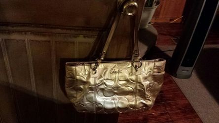 Gold coach bag