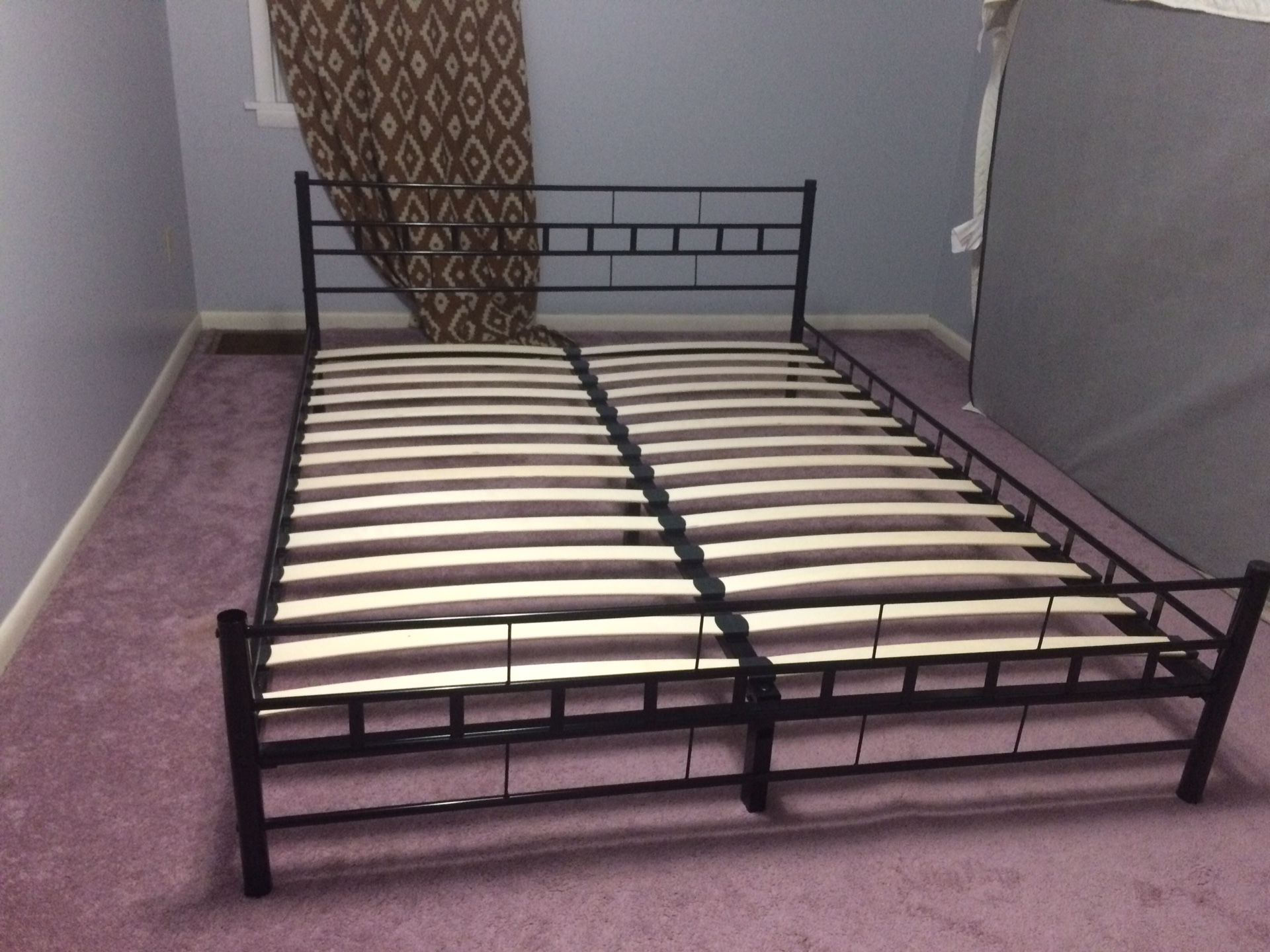 Metal Queen size bed with wooden slants