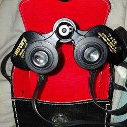  Mercury Model 1114 7x35 binoculars with a carrying case. 