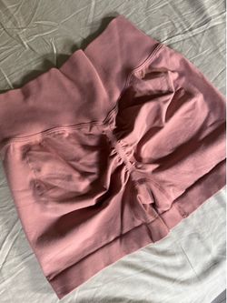 Light pink workout shorts with booty scrunch