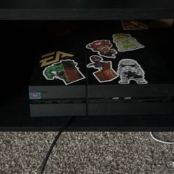 PS4 With Controller And Spider-Man Game