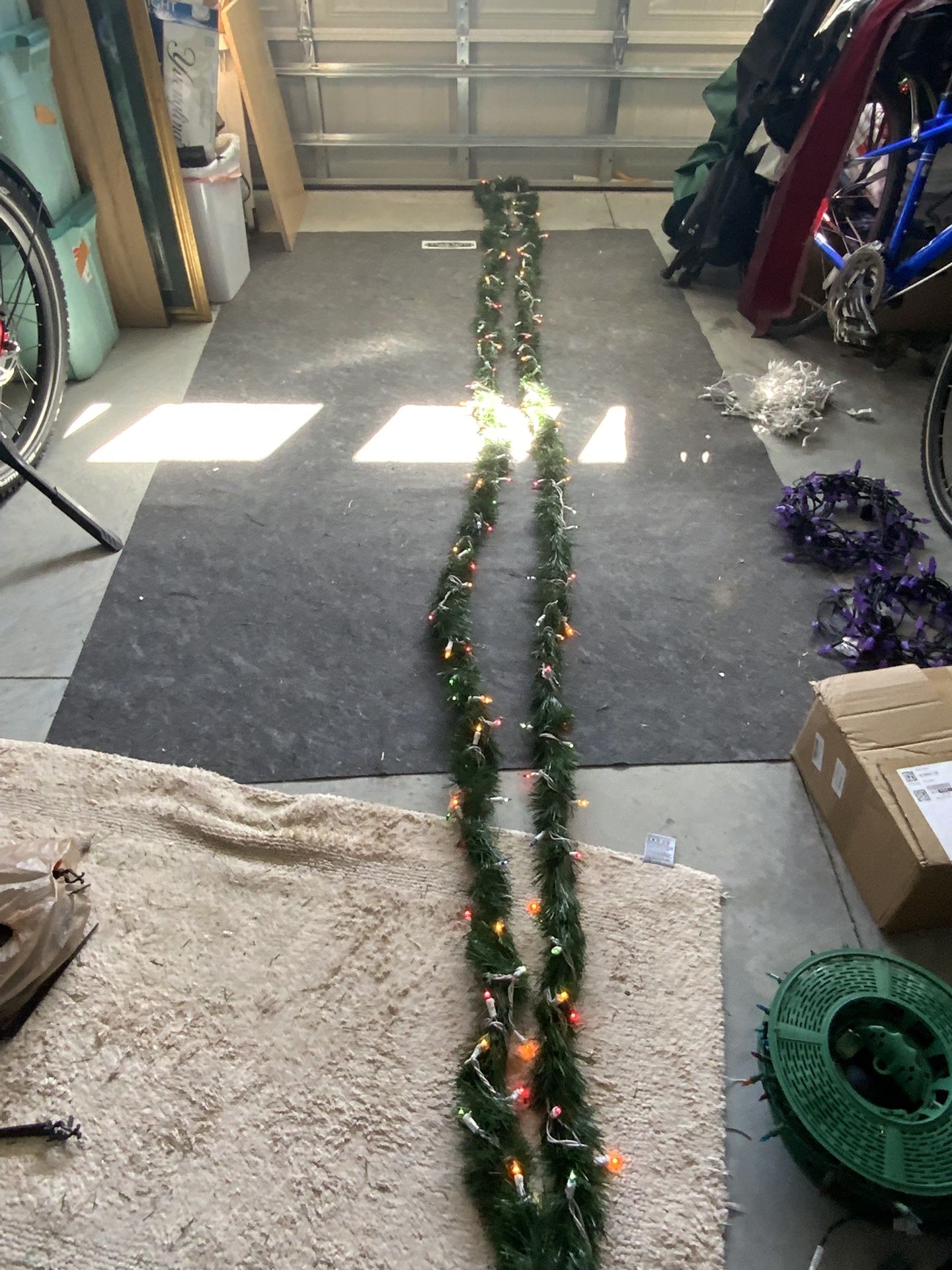 30 ft of green garland with colored lights on white cord