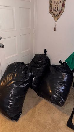 Three bags of mostly designer clothes