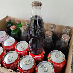 Antique Bottles and Cans of Coke