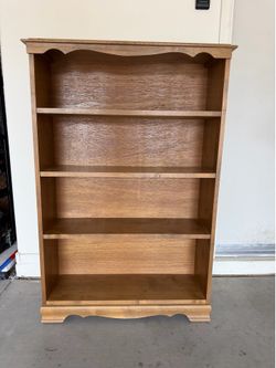 Traditional Wood Bookcase  33”x10.5”x50” Available=Pick up Riggs and Lindsay Cash Firm   Traditional wood bookcase features a medium brown finish. Thi