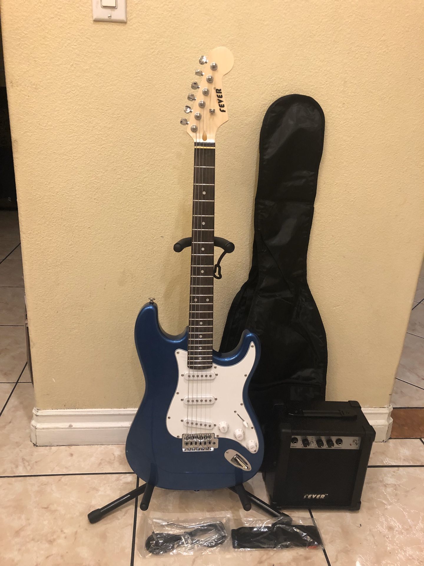 Fever electric guitar with amp case cable and strap