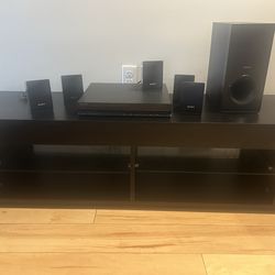 Tv stand and surround sound with speaker . Sony