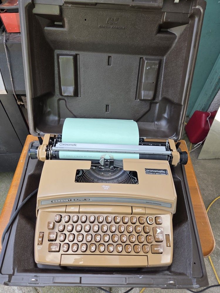 1970's brown Smith Corona Coronet Super 12 electric typewriter with case