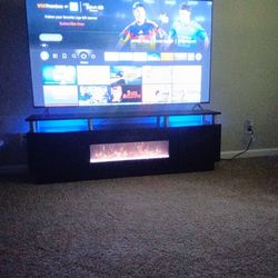 75 Inch Fire TV with Electric Fireplace Stand (Color changing lights)