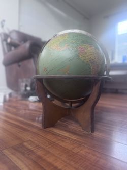 Vintage 12 inch globe with wooden stand