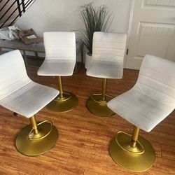 Adjustable swivel WHITE and gold stools with Black COVERS