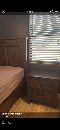 Bedroom set with California King frame, nightstand, and dresser with mirror, entertainment center and a refrigerator