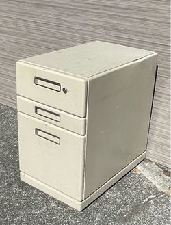 Rolling Tan metal file cabinet.  Northeast Tacoma be the Centre at Norpoint.