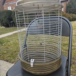 Good afternoon. 

Metal and plastic bird cage With a ringing bell inside And a Hanging hook in Excellent condition. 
