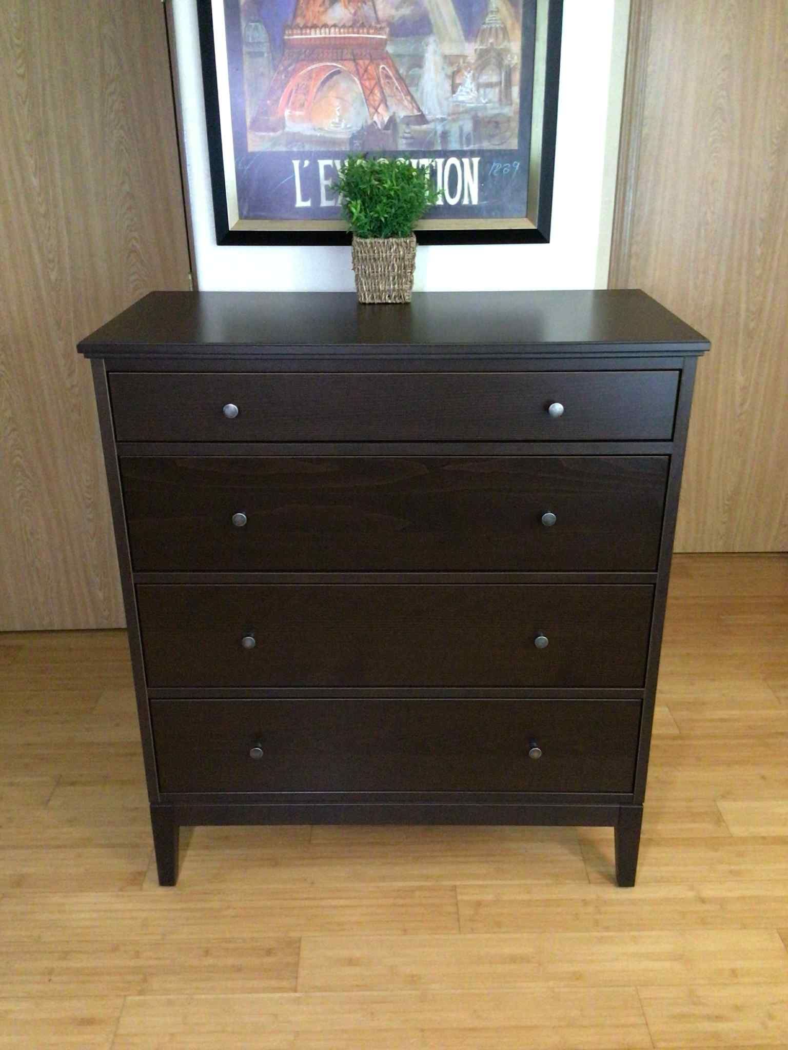 Idanas chest of 4 drawers/dresser dark brown stained.
