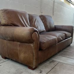 Free tan rolled arm sofa
