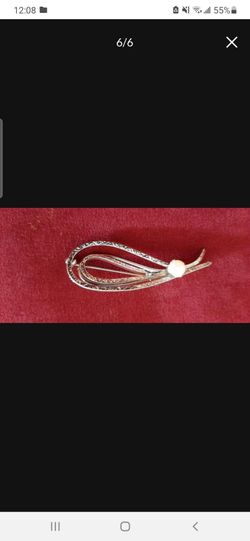 Elegant brooch with scroll design & pearl.