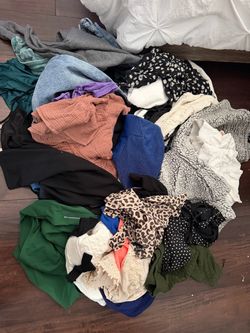 Women’s clothing sizes m-xl.  Lots with tags.  Good brands.  Big black bag. All for $20
