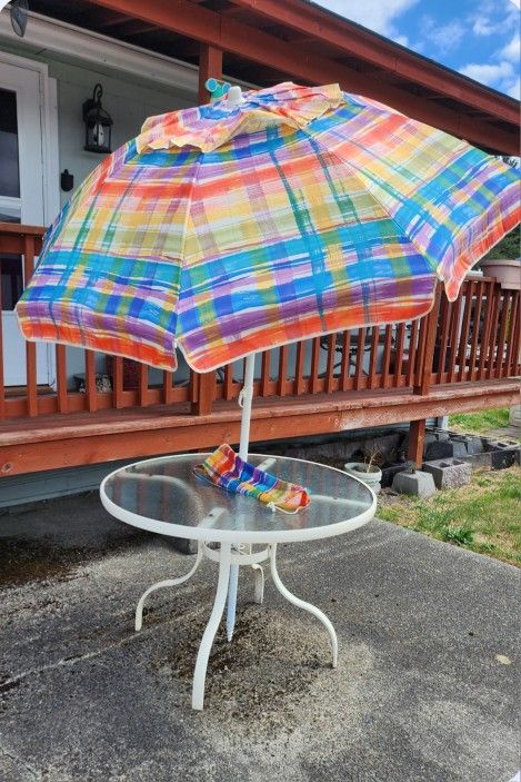 Glass Table With Colorful Tilting Umbrella
