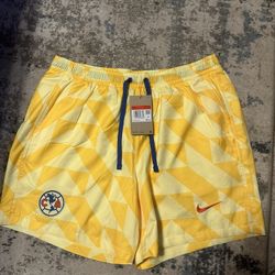 Brand new with tags Men’s Nike Club America 2023 Flow Yellow Shorts size large 